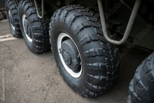 Big black wheels of an all-terrain vehicle.