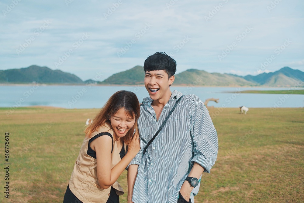 Cheerful Asian couple in the mountains. Cheerful Asian couple in the mountains.