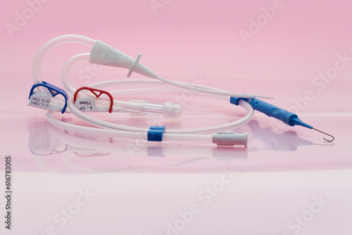 Double-lumen hemodialysis catheter set for hemodialysis, hemoperfusion and apheresis treatments on pinkish background photo