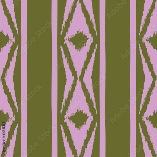 Seamless ikat pattern with pink elements on green background.