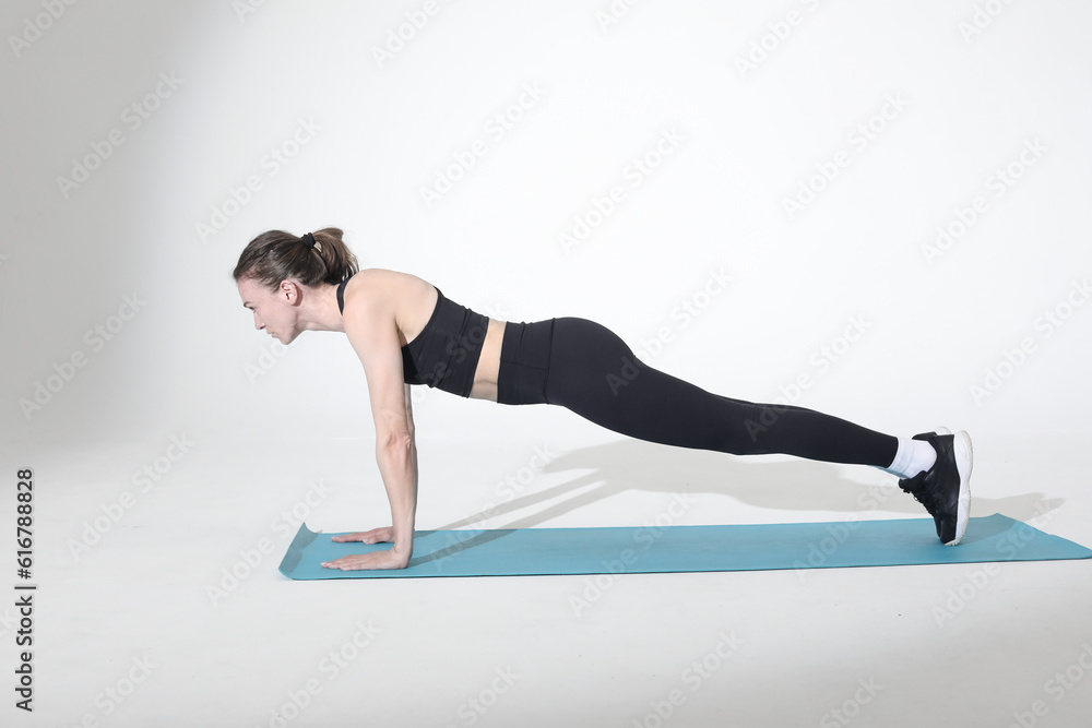 woman doing static plank fitness exercise woman doing static plank fitness exercise