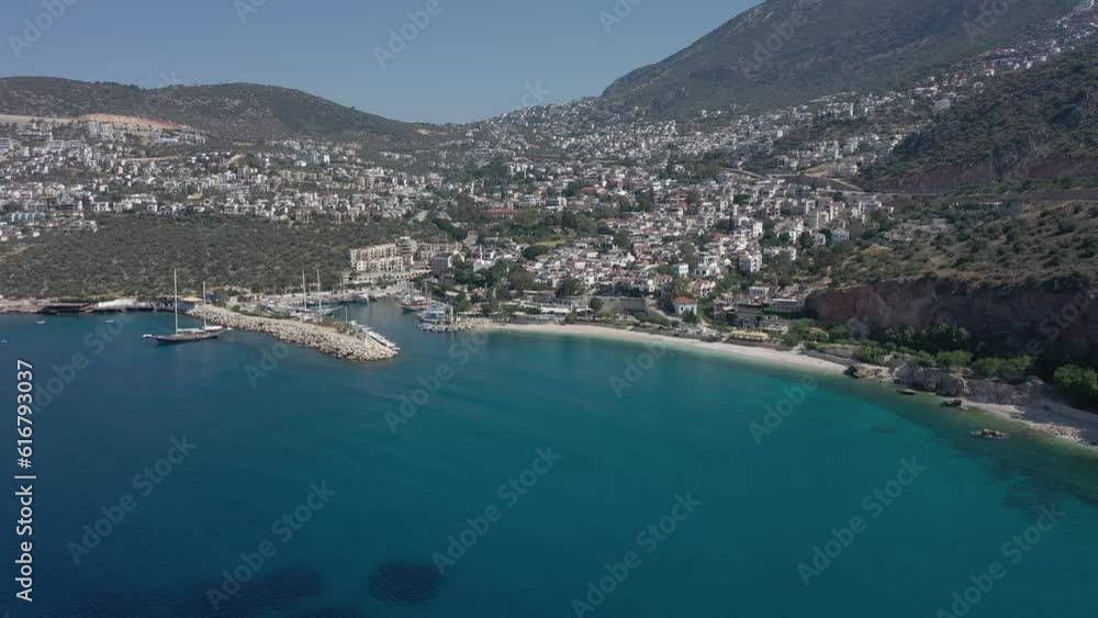 Aerial view of Kalkan town with marina, yachts, houses and streets. Aerial view of Kalkan town with marina, yachts, houses and streets.