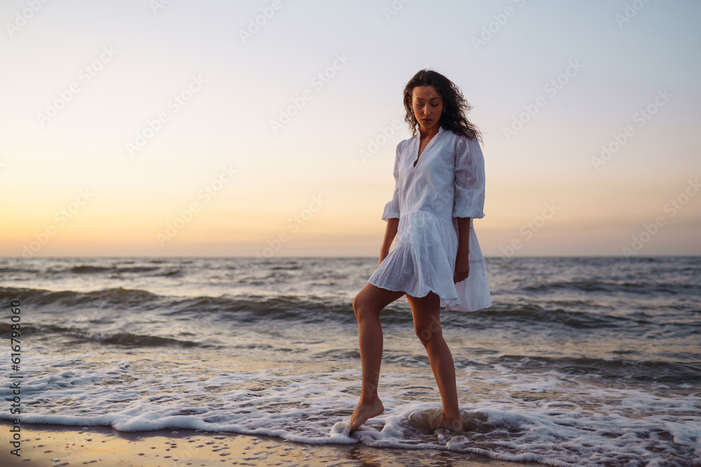 Beautiful woman enjoying a relaxing holiday at the beautiful seaside. Nature, vacation, relax and lifestyle. Summer landscape. Beautiful woman enjoying a relaxing holiday at the beautiful seaside. Nature, vacation, relax and lifestyle. Summer landscape.