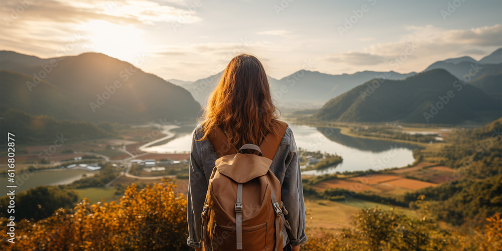 Young traveler woman backpacker at top of mountain and sea view