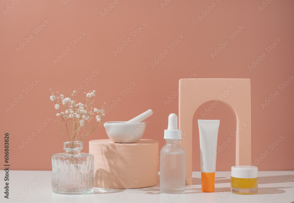 Skincare and beauty product on pastel background with flower. Skincare and beauty product on pastel background with flower.