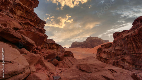 Wadi Rum desert, Jordan, The Valley of the Moon. Orange sand and rocks, storm clouds. © prystai