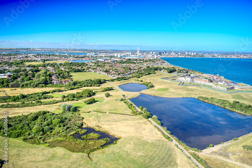 Aerial view over Gilkicker Lagoon and Gosport and Stokes Bay Golf Course towards the naval town of Portsmouth.
