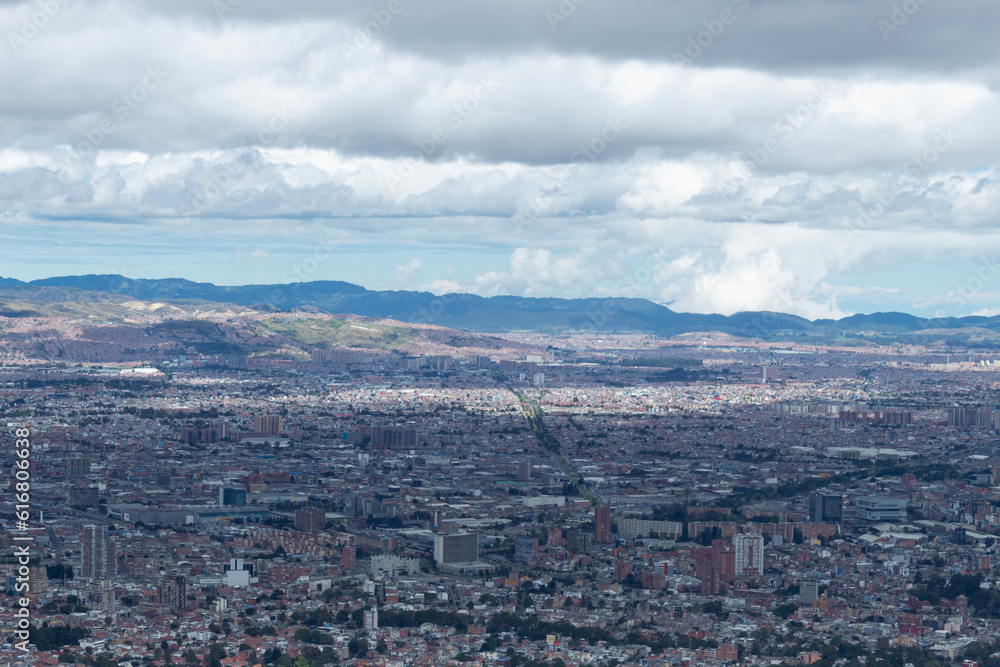 Bogota landscape viewed from eastern mountains with andean mountain range at background