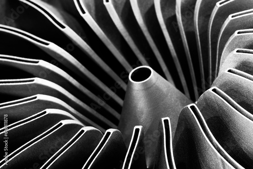 Steel blades of turbine propeller 3D printing. Close-up view. Selected focus on foreground, industrial additive technologies concept photo