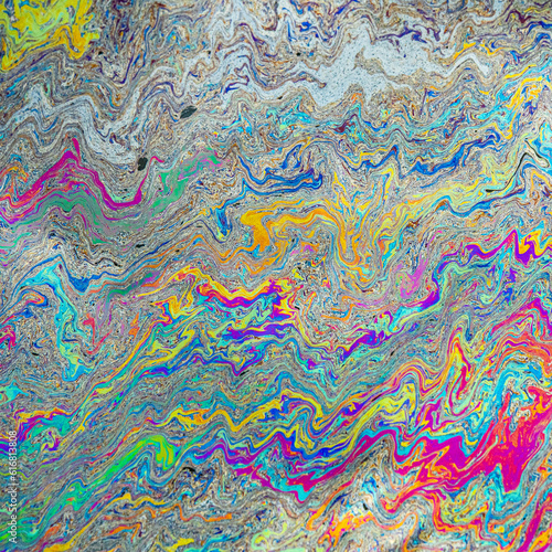 Rainbow of colours of oil on water