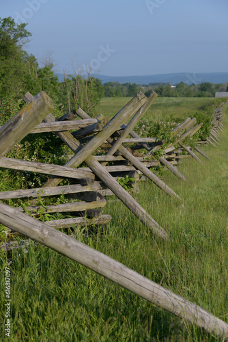 Stacked wooden fence on the edge of the Gettysburg battlefield, site of the bloodiest battle of the Civil War