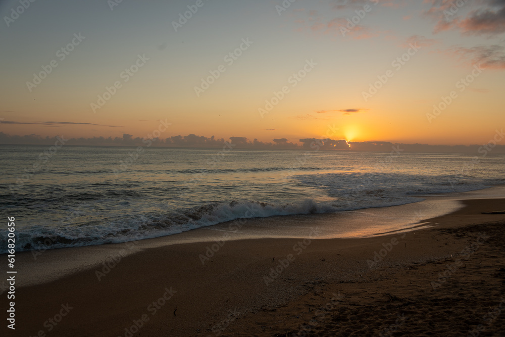 Sunrise at Beverley beach, Sun just above the clouds on the horizon Sunrise at Beverley beach, Sun just above the clouds on the horizon