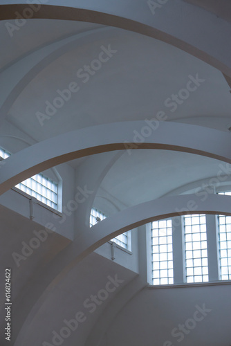 High ceiling. White abstract background with windows.