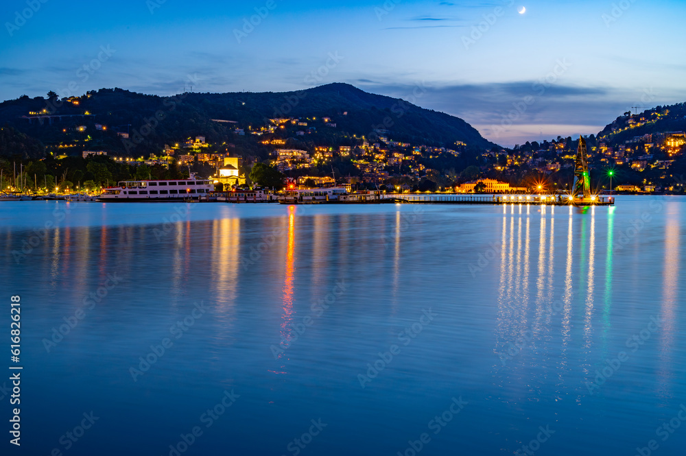 Panorama of the lakefront of Como, and of the outer dam with the Life Electric monument, in a summer evening.
Panorama of the lakefront of Como, and of the outer dam with the Life Electric monument, in a summer evening.