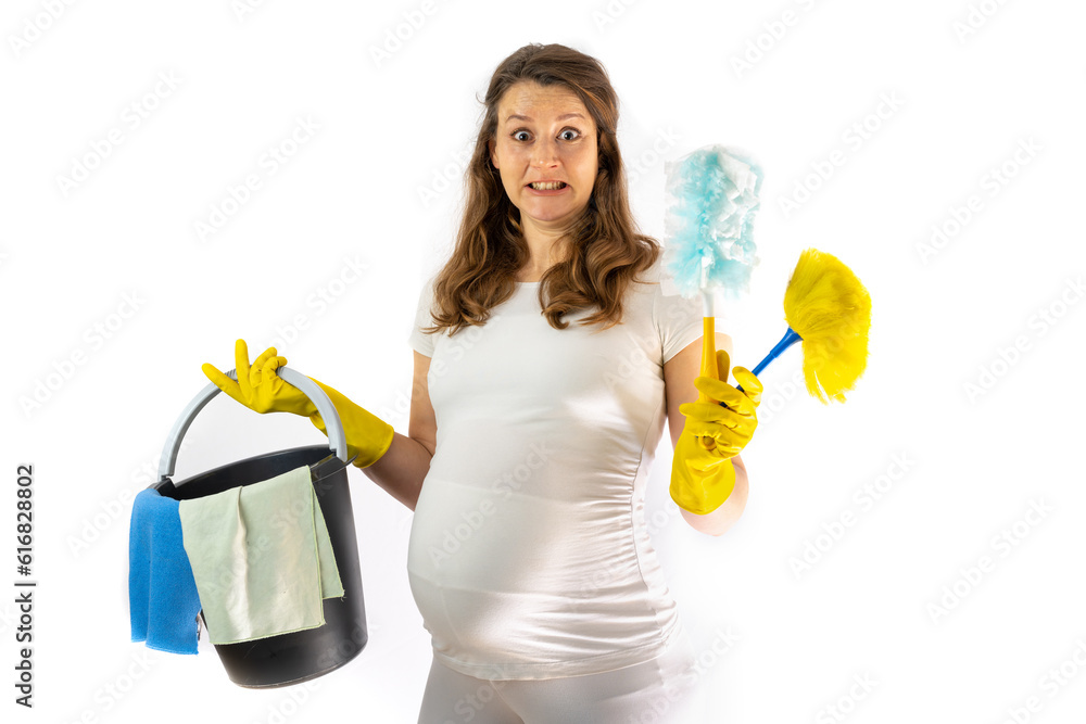 Pregnant woman with baby bump and shocked facial expression holds