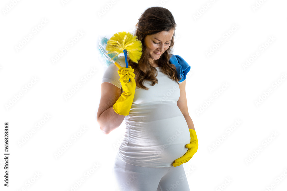 Pregnant mother holds cleaning utensils in her hands and smiles at her belly saying Pregnant mother holds cleaning utensils in her hands and smiles at her belly saying