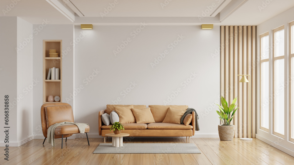 Obraz premium Living room wall mockup in bright tones with leather sofa and leather armchair.