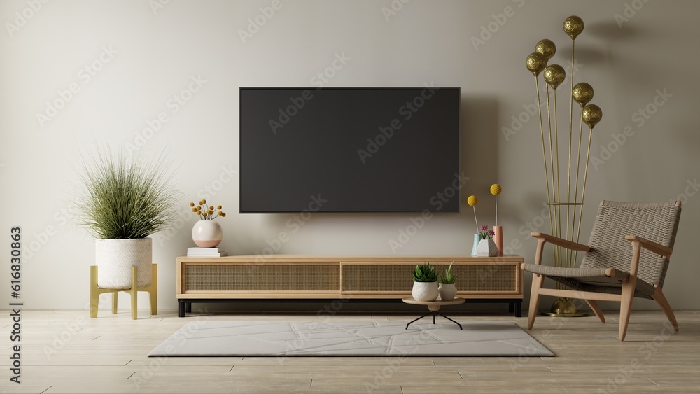 Mockup a cabinet TV wall mounted with armchair in living room with a cream color wall. Mockup a cabinet TV wall mounted with armchair in living room with a cream color wall.