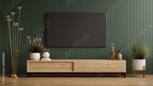 Mockup a cabinet TV wall mounted on dark green wooden slatted wall background.