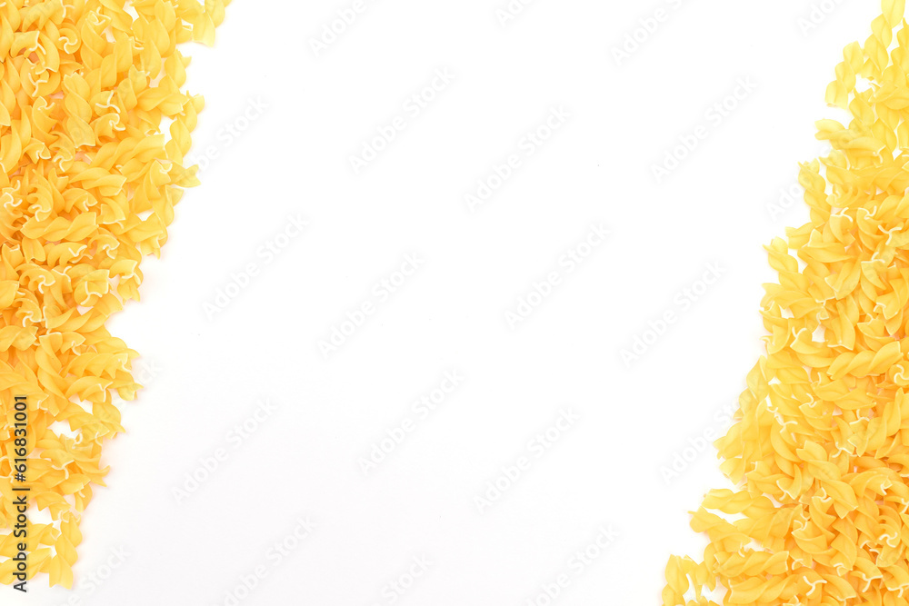 Uncooked Fusilli Pasta with Copy Space on White Background. Raw and Dry Macaroni. Fat and Unhealthy Food - Flat Lay Uncooked Fusilli Pasta with Copy Space on White Background. Raw and Dry Macaroni. Fat and Unhealthy Food - Flat Lay