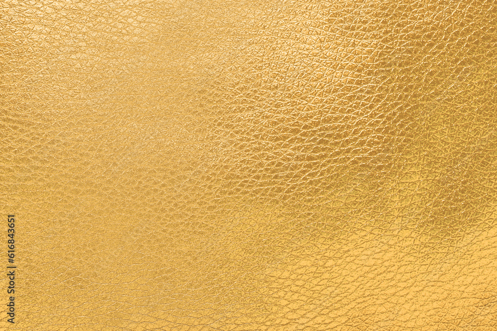 Closeup view of shiny golden surface as background Closeup view of shiny golden surface as background