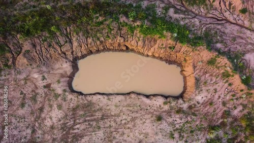 pond, water, erosion, erosional, erosive, dirt, earth, pollution, polluted, drone, aerial, lift up, top down, top-down, land, landscape, colors, colorful, nobody, no people, dirty, moving, motion, rai