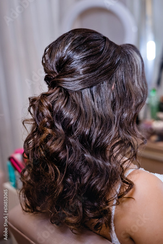Hairstyle for a bride with a silver accessory in her hair