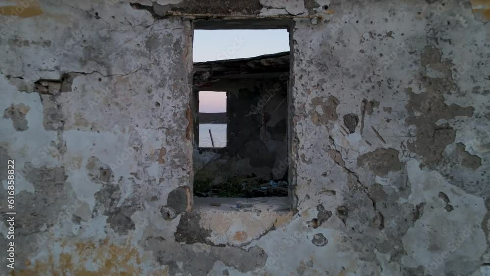 Drone shot from inside an abandoned house facing the sea in Porto Palermo. Drone shot from inside an abandoned house facing the sea in Porto Palermo.
