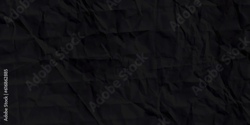 Texture of a crumpled Black sheet of paper. Empty background. Black creased paper.