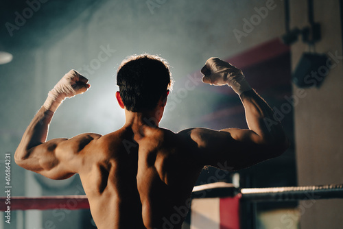 portrait of Asian man boxer having strength body are working out exercise in gym, athlete sportsman fighter male person having strong muscle training active in sport fitness gym for muscular power up