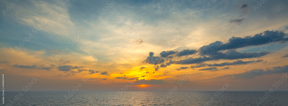 wide angle shot of beautiful sunset on tropical sea at summer time from tilt-shift lens for banner background