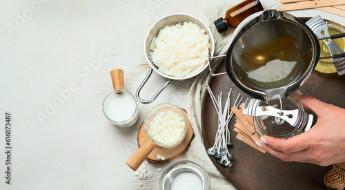 Set for homemade natural eco soy wax candles, Woman making decorative aroma candle at table.