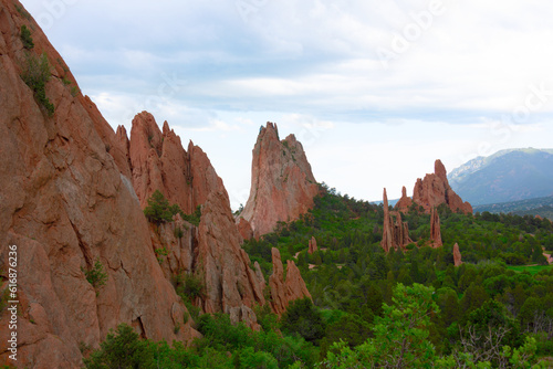 Garden of the Gods national park in the spring with lush green forest trees in Colorado Springs, CO USA.
