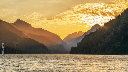 Sunsetting behind the mountains of Muchalat lake near Gold River on Vancouver Island  British Columbia  Canada.