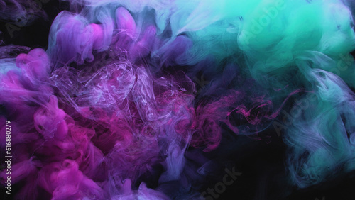Color smoke. Paint water splash. Underwater splash. Cyan blue purple mist cloud blend floating on dark black abstract art background.