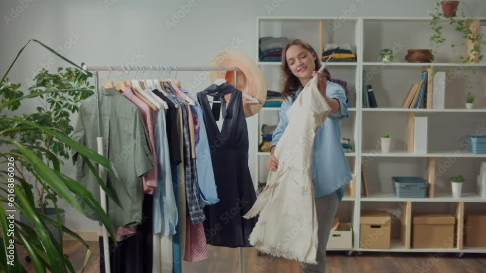Smiling Young Woman Choosing Wardrobe at Home, Beautiful Woman Chooses Clothes for Work or other Important Events to Look Professional and Confident, Dressing for Success Smiling Young Woman Choosing Wardrobe at Home, Beautiful Woman Chooses Clothes for Work or other Important Events to Look Professional and Confident, Dressing for Success