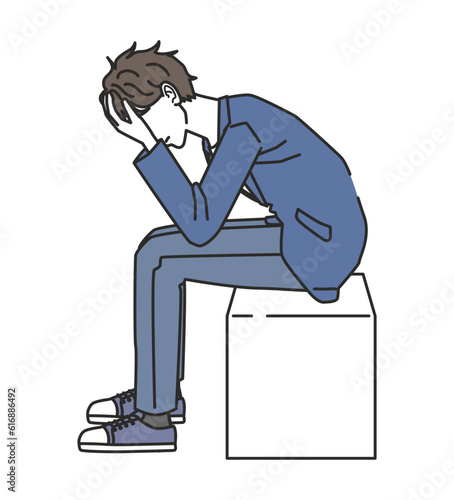 落ち込むオフィスカジュアルコーデの男性