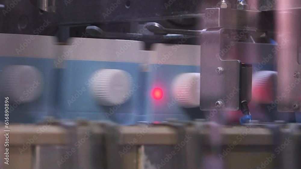 A line of dairy products. Packages of dairy products are moved along a conveyor line at the factory. Production conveyor belt at the dairy plant.