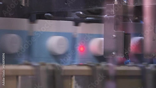 A line of dairy products. Packages of dairy products are moved along a conveyor line at the factory. Production conveyor belt at the dairy plant.