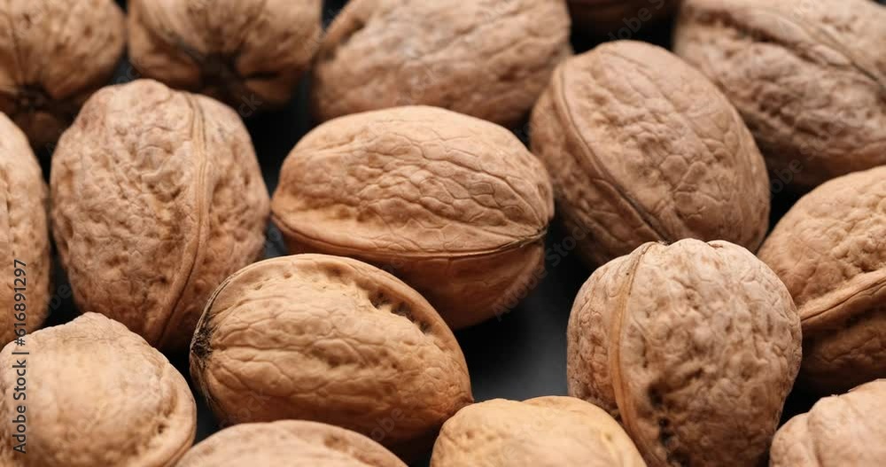 Whole walnuts close-up on rotating platform Whole walnuts close-up on rotating platform