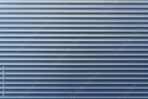 Texture and pattern of exterior roller aluminum shutters on a large shopwindow as background