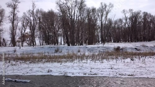 Wallpaper Mural Aerial: Drone Flying Forward Over Men And Horse On Snow By River Against Bare Trees In Forest - Billings, Montana Torontodigital.ca
