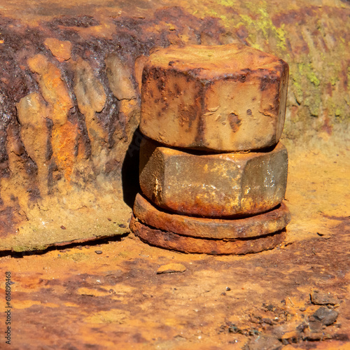 Rusty old nut and bolt on a vintage excavator photo