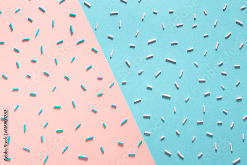 sprinkles with trendy hard shadow on blue and pink background for design banner, poster, flyer, card, postcard, cover, brochure over pink and blue, flat lay