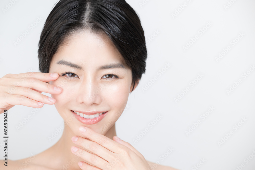 Asian (Japanese) woman easy to use for beauty, skin care and esthetics Close-up of face Touching parts around eyes and mouth Asian (Japanese) woman easy to use for beauty, skin care and esthetics Close-up of face Touching parts around eyes and mouth