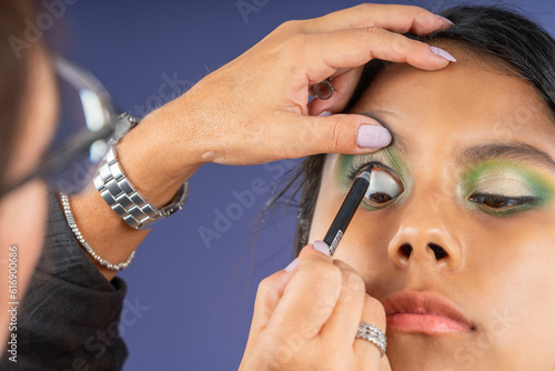 Eye makeup on young woman with open eyes