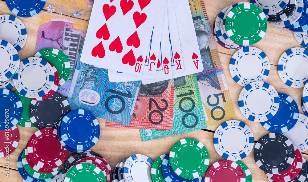 Obraz premium Card combination on australian dollars with casino chips