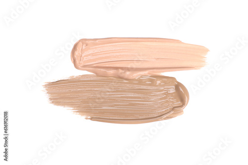 Smears of foundation cream in different shades isolated on white