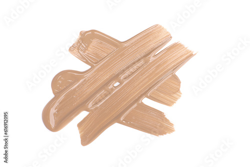 Smudged beige foundation cream isolated on white