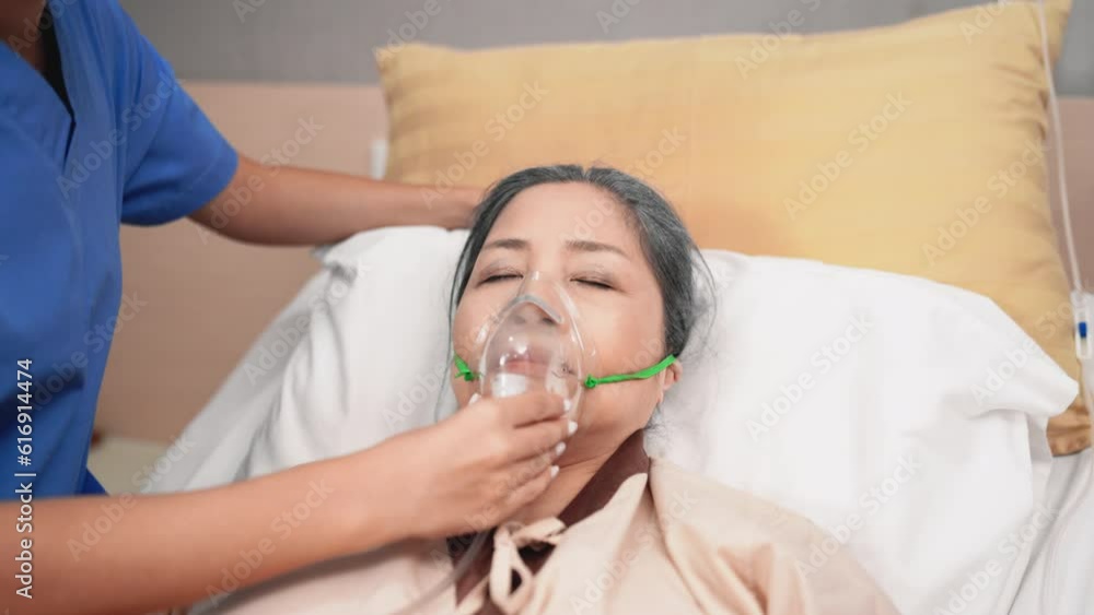 Doctor and nurse measuring blood pressure of patient in recovery room after treatment. Doctor and nurse measuring blood pressure of patient in recovery room after treatment.